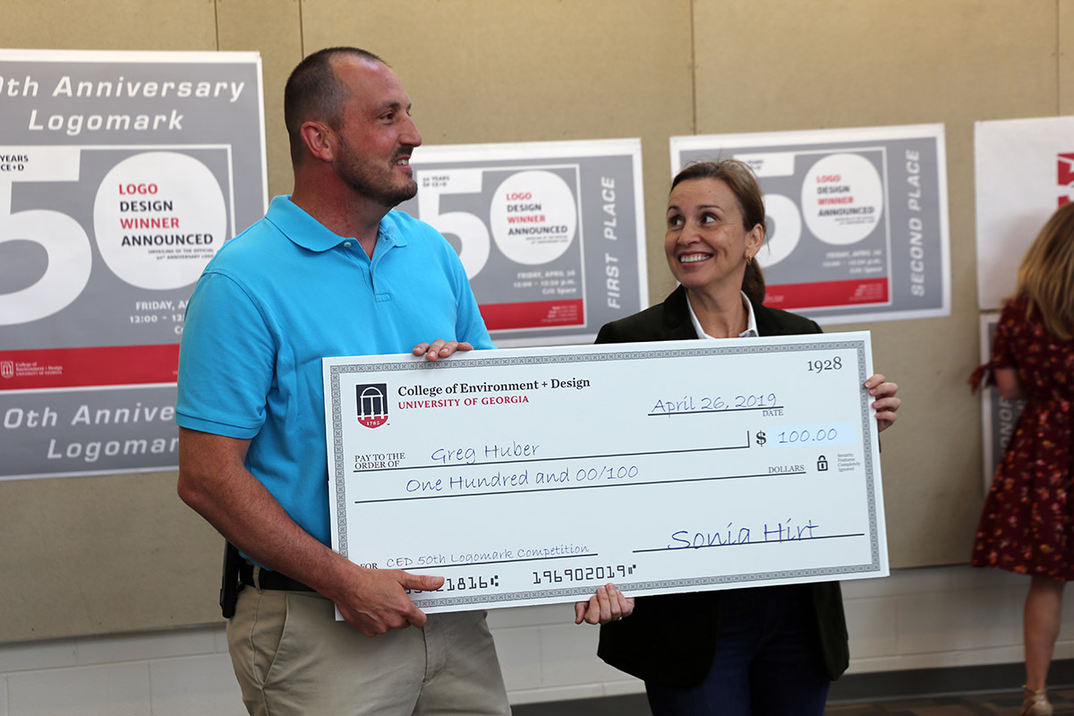 Greg Huber receiving check from Dean Hirt